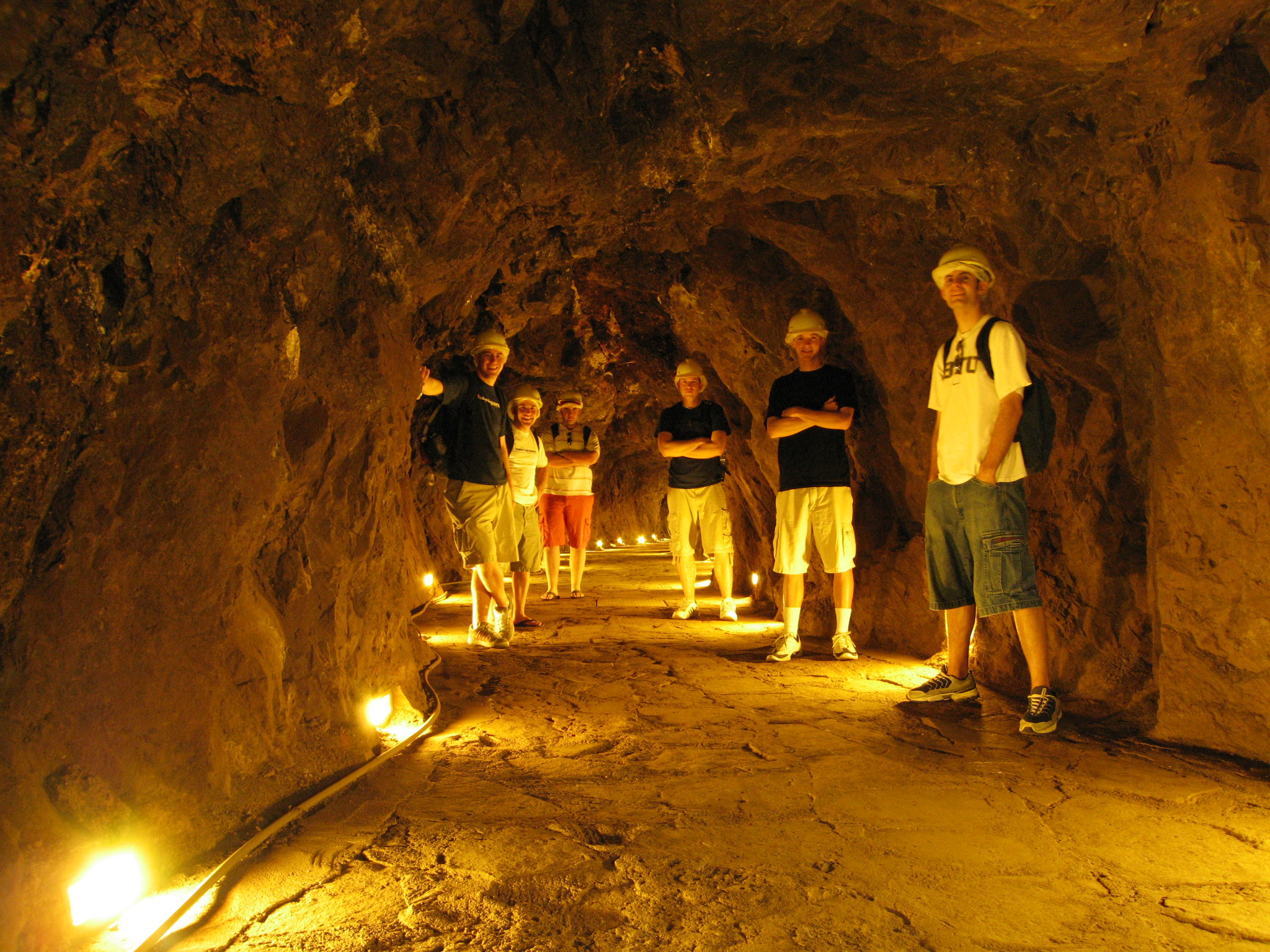 A few students descend into an abandoned silver mine
	turned tourist attraction.